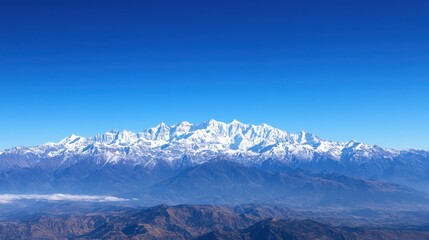 Obraz premium Majestic Snow-Capped Mountain Range Under Clear Blue Sky