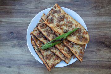 Turkish and Arabic Traditional Ramadan Bread Sliced Bicak Arasi (Pide or Lahmacun) serving