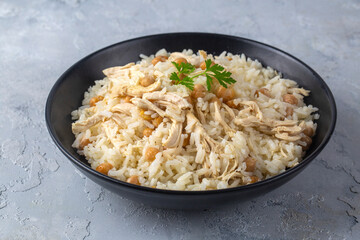 Traditional delicious Turkish food; Rice with chickpeas and chicken (Turkish name; Tavuklu nohutlu pilav or pilaf)
