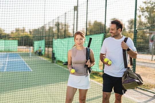 Two friends going to play tennis