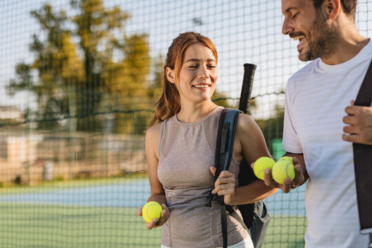 Two friends going to play tennis