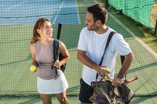 Two friends going to play tennis