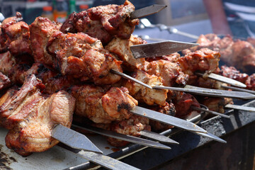 Cooked kebab on skewers on the street, close-up