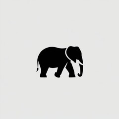 Obraz premium Elephant Silhouette Walking Gracefully with a Curved Trunk
