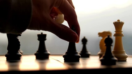 hand moving chess killing king piece board background competition success success Business Strategy.