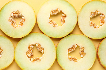 Slices of sweet melon on yellow background