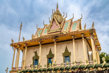 Buddhist pagoda with asura statues holding naga, North Phnom Prasit pagoda, Phnom Penh, Cambodia