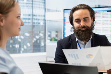 Financial advisor guiding young adult in trading shares and making informed investment decisions. Economic agent offers gen Z girl advice on buying, selling, or holding stocks to optimize returns