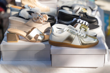 Second hand shoes for sale at street flea market. new and used shoes on sale at street flea market.
