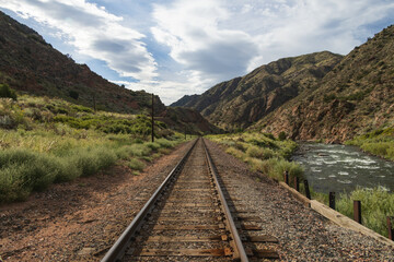 Fototapeta premium Railroad tracks next to the Arkansas River in Royal Gorge, Canon City, Colorado