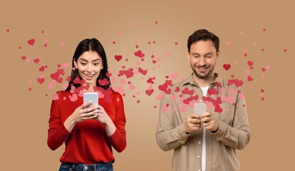 A couple is joyfully interacting with their smartphones, surrounded by floating hearts. They appear affectionate and engaged, celebrating their love on St. Valentine's Day.
