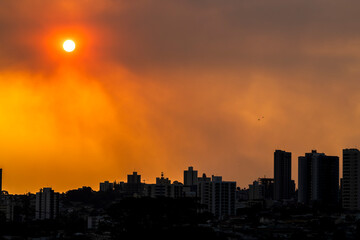 Fototapeta premium A thick layer of smoke covered the brazilian city during the late afternoon. The hot, dry weather and the air heavy with smoke make it harder for people to breathe.