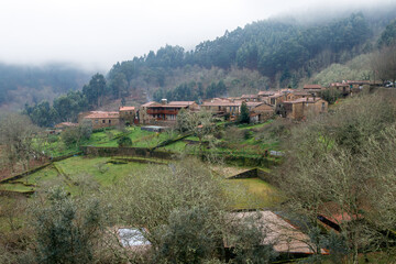 Beautiful view of the village of Gondramaz in the Serra da Lousã in Portugal, on a misty winter day.