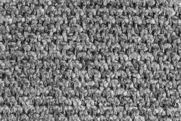 Texture of gray jacquard fabric, close up of rough weave macro. Material for home textile, upholstery and curtain decor, garment. Background, wallpaper, backdrop.