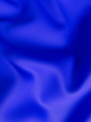 Close-up macro shot of textured blue viscose fabric, with a shallow depth of field creating a soft blur effect.