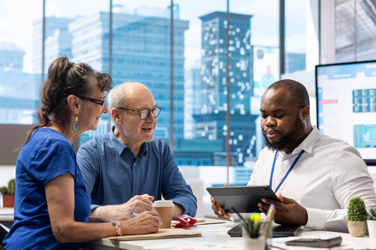 Senior people in a consultation with a financial expert to discuss about retirement plans, covering investment strategy to secure life savings and financial security. Insurance agency broker.