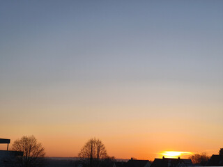 Sunset on the horizon on the outskirts of the city