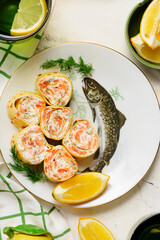  crepes rolls with cream cheese, salmon and dill. top veiw.