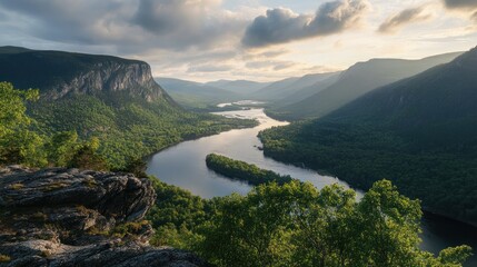 Fototapeta premium Breathtaking vista of a winding river through a majestic mountain valley