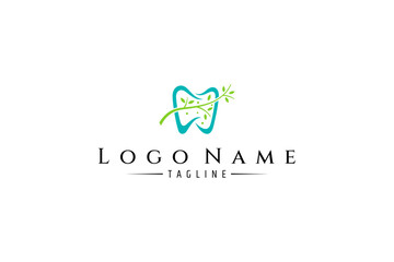 tooth logo with twig leaf combination in flat design style