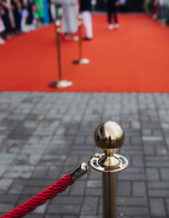 Red carpet with ropes and golden barriers on a luxury party entrance, cinema premiere tv film...
