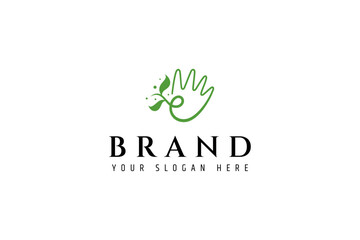 Fototapeta premium hand logo with leaf elements in flat design style