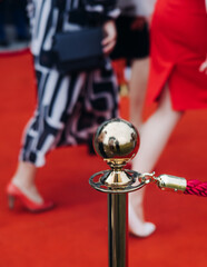 Red carpet with ropes and golden barriers on a luxury party entrance, cinema premiere tv film...