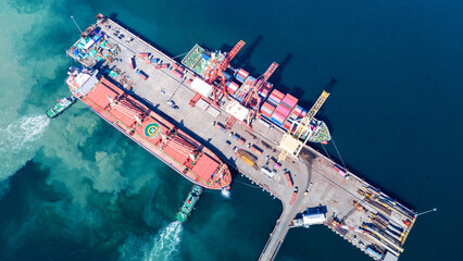 Tug boat pulling Cargo container ship go to international yard port. technology freight shipping with smart port. Cargo ship at logistic warehouse. © Yellow Boat