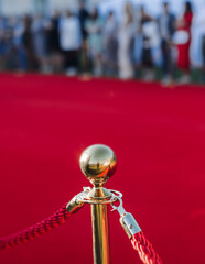 Red carpet with ropes and golden barriers on a luxury party entrance, cinema premiere tv film...