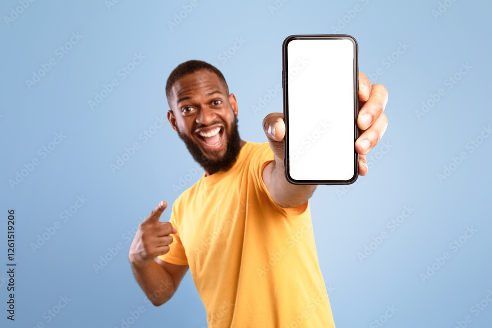 Poster mobile app advertisement. excited african american man pointing at smartphone with empty screen on b