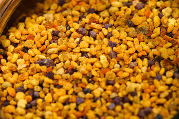 Detail photo of bee pollen, which is one of nature’s best superfoods, containing nearly all nutrients that the human body needs and taste amazing. Perfect for morning smoothies or outs bowl. 