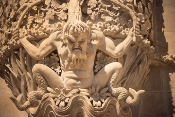Close-up of Triton sculpture in Pena Palace’s decorative stonework.