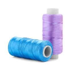Spools of bright sewing threads isolated on white