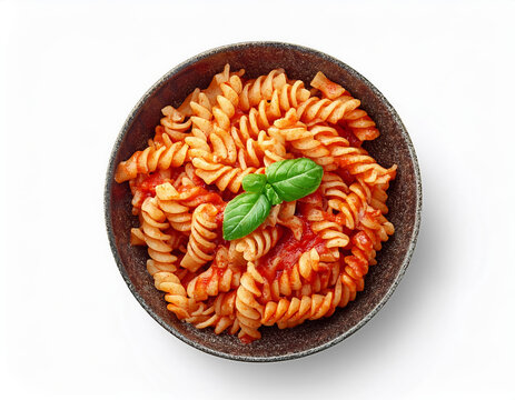 Fusilli pasta cooked with tomatoes sauce and basil isolated on white background with clipping path, top view.