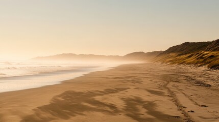 Obraz premium Serene Beach Landscape at Sunset with Gentle Waves and Soft Light