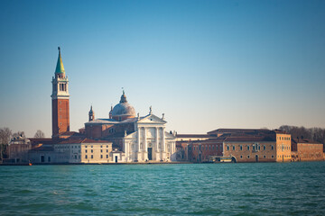 View of San Giorgio Maggiore Island with its iconic church and bell tower across the water in Venice.