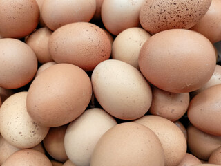 Close Up Pile Of Brown And Beige Eggs