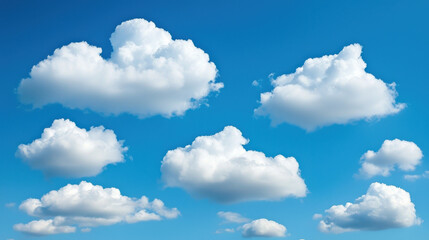Obraz premium Fluffy white clouds scattered across bright blue sky create serene atmosphere
