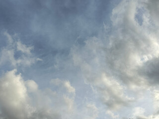 Pastel Sky With Fluffy CloudsWith Fluffy Clouds