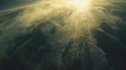 Aerial view of a vast icy landscape illuminated by sunlight, showcasing the beauty of nature