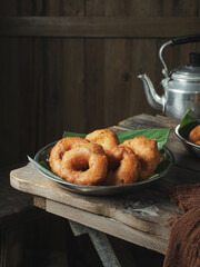 Crispy South Indian Ulundu Vadai or Lentil Doughnuts on a Banana Leaf