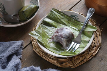 Black Glutinous Rice on a plate. Malay called Kuih Koci