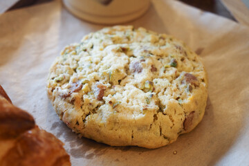 Freshly baked cookie on parchment paper in a cozy cafe