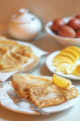 Traditonal pancakes on Shrove Tuesday/Pancake Day served with lemon and sugar