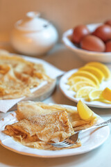 Traditional English pancakes with lemon and sugar for Lent or Shrove Tuesday/Pancake Day religious celebration