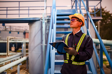 Engineers are checking the operation of water pumps in a large waterworks.