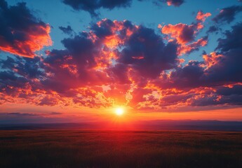 Colorful Sunset Over Fields Landscape with Clouds and Vibrant Colors and Light. Golden Sky at Sunset Horizon. Scenic View. Natural Light and Dramatic Sky. Peaceful Scene. Beautiful Panorama of
