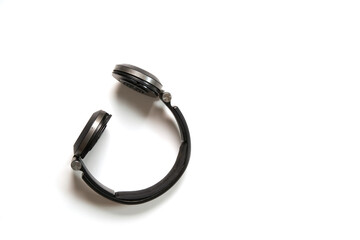 Broken headphones as a concept of the fragility of plastic use. Copy space