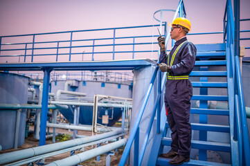 Engineers are checking the operation of water pumps in a large waterworks.