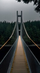 Obraz premium Suspension Bridge in Forest with Wooden Walkway and Metal Cables